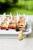 Sour cherry cake with slivered almonds, sliced