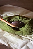 Stevia powder with a slotted spoon