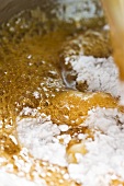 Honey and sugar caramel being boiled