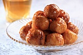 Fried dough balls with rum sauce (Arabia)