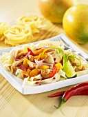 Chicken with mango and cashew nuts on tagliatelle (Asia)