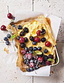Filo tart with vanilla cream and berries and cherries