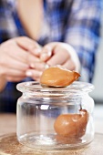 Filling a preserving jar with poached pears