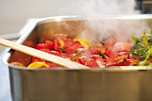 Tomatoes stewing with herbs