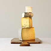 Four varieties of cheese, stacked