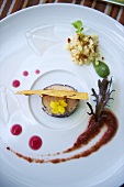 Goose live with edible flowers and sauce