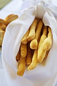 Hand made Grissini (breadsticks) wrapped in a towel