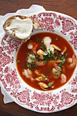 Tomato soup with seafood, bread with aioli