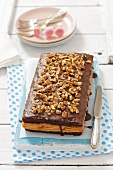 Chocolate biscuit cake with crackers, caramel and nuts