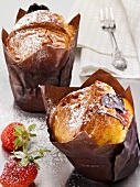 Strawberry muffins in brown paper cases
