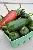Jalapeno peppers in a cardboard box