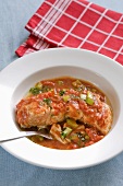 Salmon fillet in a vegetable and tomato sauce