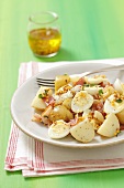 Potato salad with quail's eggs, bacon and a mustard dressing