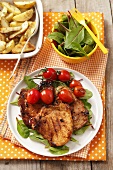 Grilled pork chop with cherry tomatoes