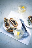 Crostini with tapenade and gimlet