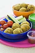 Vegetables and minced meat balls in a lunchbox