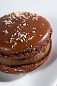 A chocolate macaroon with grated coconut