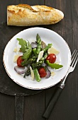 Asparagus salad with rocket, tomatoes, parmesan and a baguette