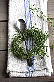 A rosemary wreath and a spoon