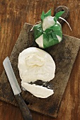 Burrata (Italain cream cheese) on a wooden board