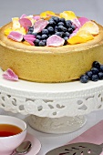Cheesecake with fresh blueberries and rose petals