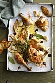 Roast spring chicken with garlic, olives and herbs