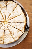 A meringue tart seen from above in the baking tin