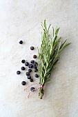 A sprig of rosemary and juniper berries