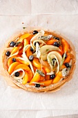 Fruit tart with sugared herbs