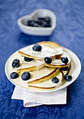Pancakes with blueberries and yogurt sauce