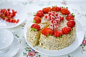 A strawberry and redcurrant cake, sliced