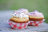 Muffins with cream and sprinkles