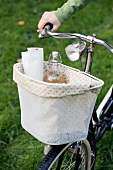 Drinks in a bicycle basket for a picnic