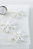 Iced snowflakes on baking paper