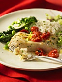 Fried halibut with tomatoes and rice