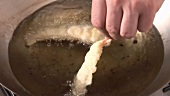 Deep-frying prawns