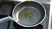 Frying an egg in a little oil in a frying pan