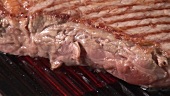 Grilling beefsteak on an electric grill