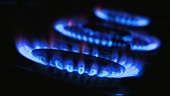 Three burning gas flames
