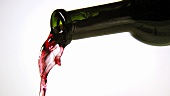 Pouring red wine out of a bottle