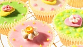 Colourful cupcakes on cake rack