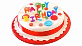 Geburtstagstorte als Hut, mit Happy-Birthday-Kerzen dekoriert