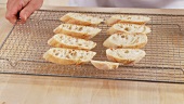 Ciabatta slices on an oven rack
