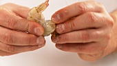 Cleaning prawns: removing the head, shell, tail and entrails (English Voice Over)
