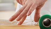 Clingfilm being removed from a roll