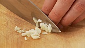Chopping a garlic clove