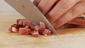Bacon being diced