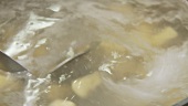 Gnocci being cooked in salt water