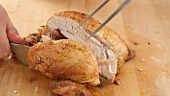 Roast chicken being prepared: carving (German Voice Over)