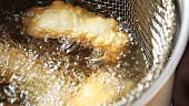 Fish fillets in a frying basket